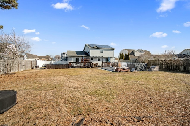 view of yard with a pool side deck