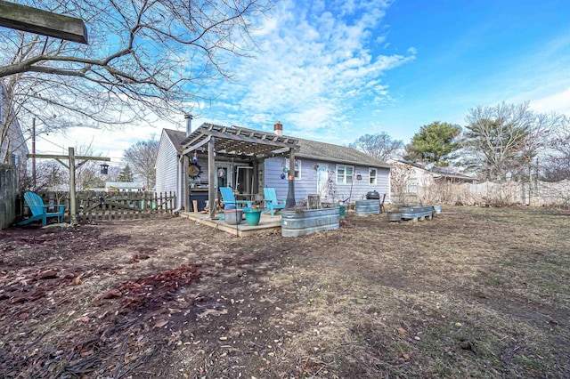 rear view of house with a pergola