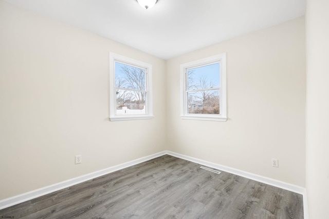 spare room featuring hardwood / wood-style flooring