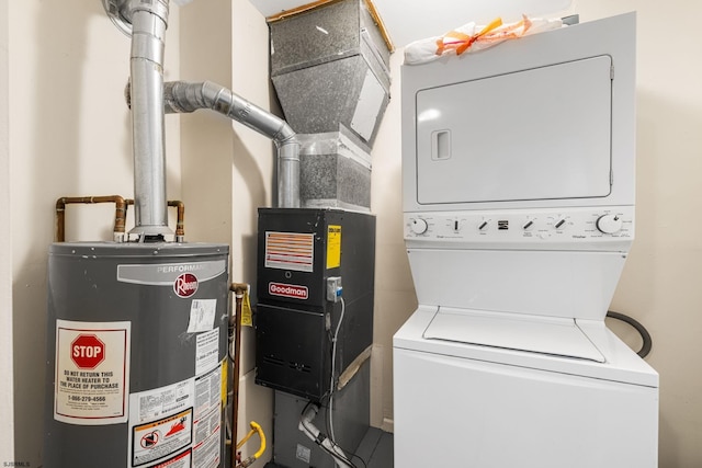 utilities featuring stacked washer and dryer and gas water heater