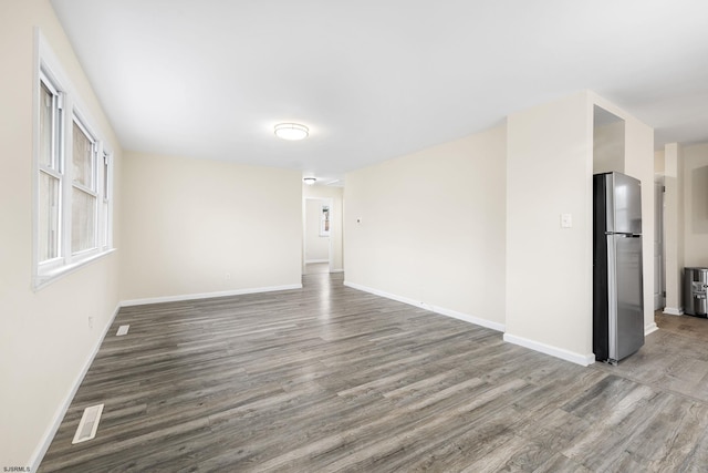 empty room featuring hardwood / wood-style flooring