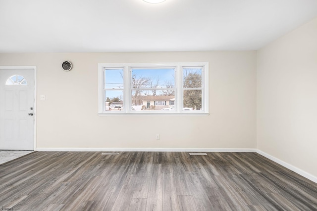 foyer with dark hardwood / wood-style floors