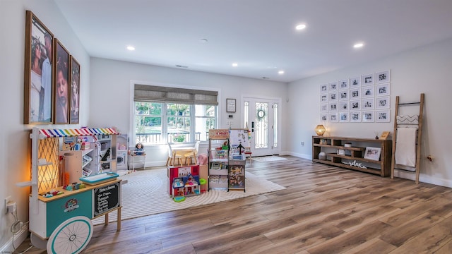 rec room with wood-type flooring