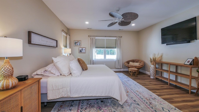 bedroom featuring dark hardwood / wood-style floors and ceiling fan