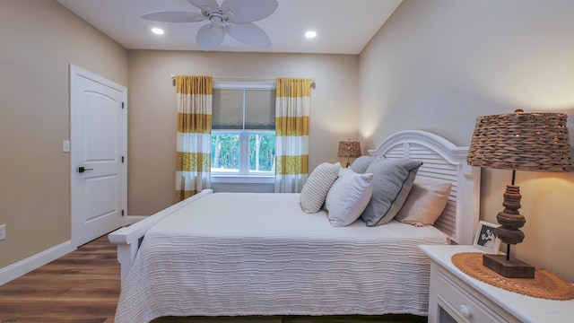 bedroom featuring ceiling fan and dark hardwood / wood-style flooring