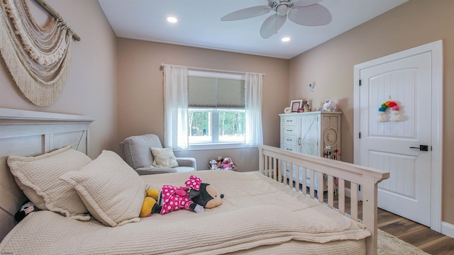 bedroom with hardwood / wood-style flooring and ceiling fan