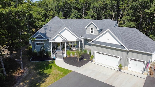 view of front of home featuring a porch and a garage