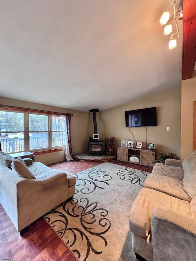 living room featuring a wood stove and parquet floors