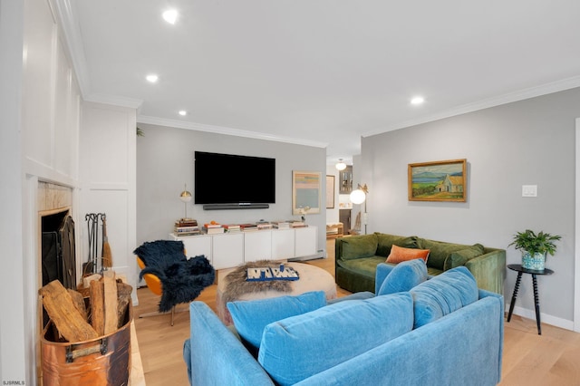 living room with light hardwood / wood-style flooring and ornamental molding