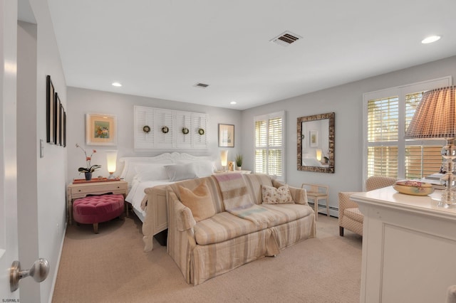 carpeted bedroom featuring a baseboard radiator