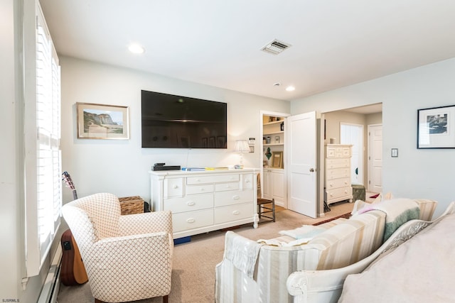 living room featuring a healthy amount of sunlight and light carpet