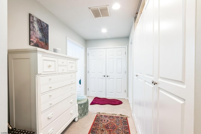 carpeted bedroom with a closet