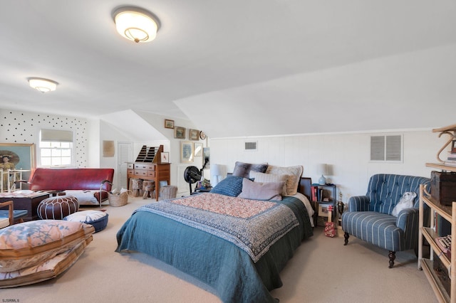 bedroom with vaulted ceiling and carpet floors