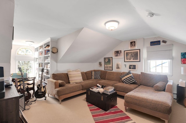 carpeted living room featuring lofted ceiling, a baseboard heating unit, and a wealth of natural light