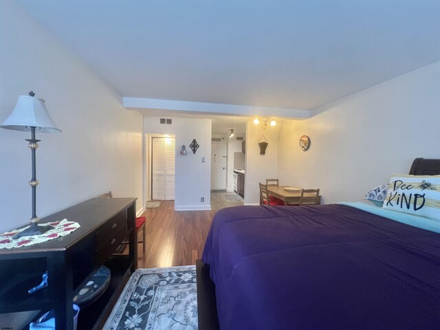 101 S Raleigh Unit 513, Atlantic City, NJ 08401 - bedroom with hardwood / wood-style flooring and connected bathroom