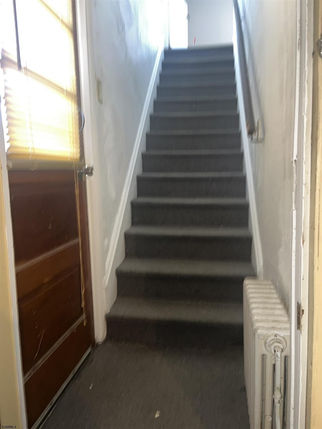 staircase with radiator