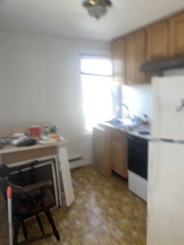 kitchen featuring sink, light hardwood / wood-style flooring, baseboard heating, white fridge, and electric stove