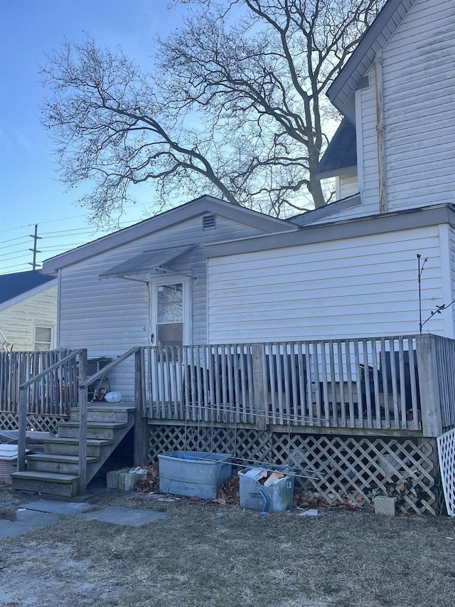property entrance with a deck