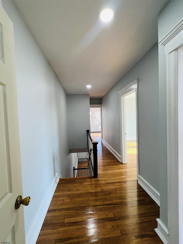 hall with dark hardwood / wood-style flooring