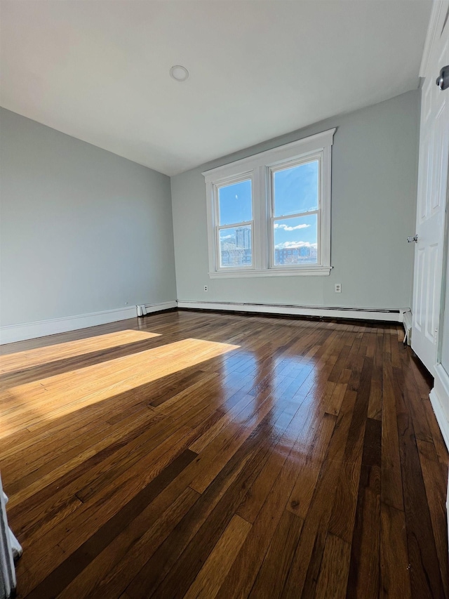 spare room featuring hardwood / wood-style floors