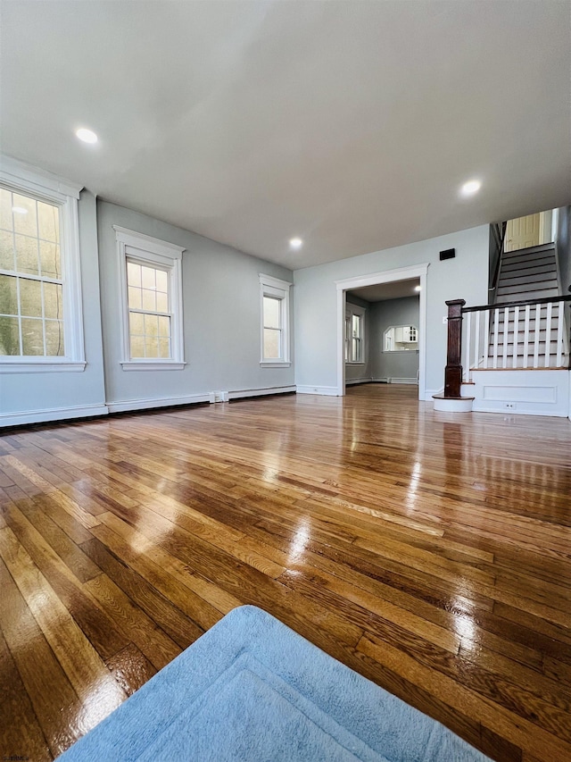 unfurnished living room with wood-type flooring