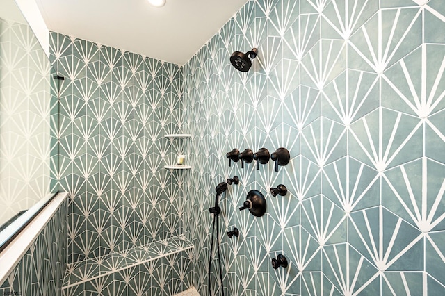 bathroom with tiled shower