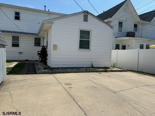 rear view of house with a patio