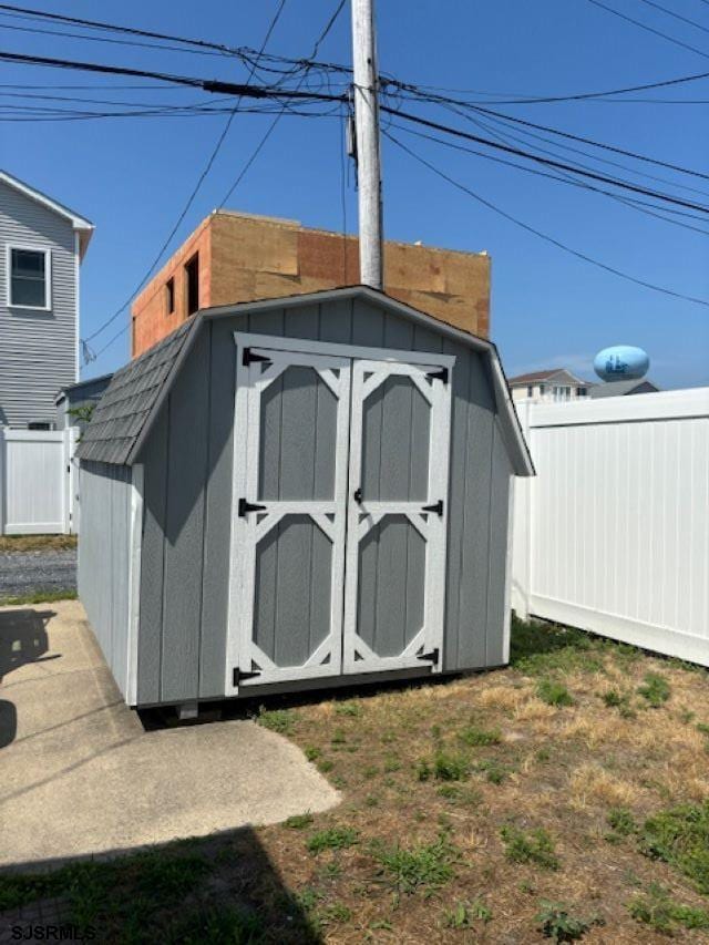 view of shed with a fenced backyard