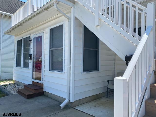 view of side of property featuring entry steps