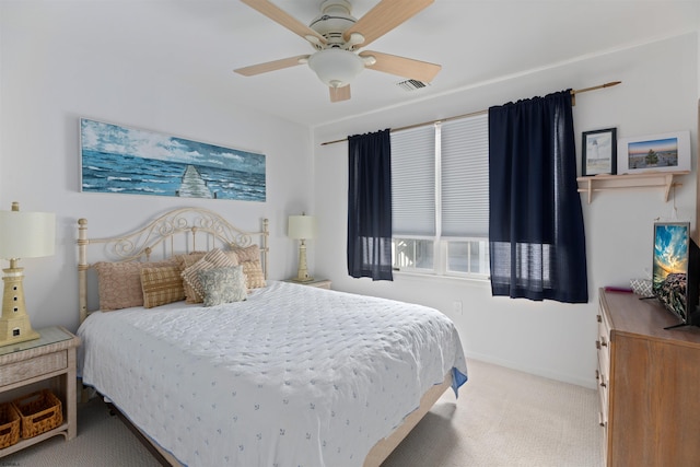 bedroom featuring carpet floors, visible vents, baseboards, and a ceiling fan