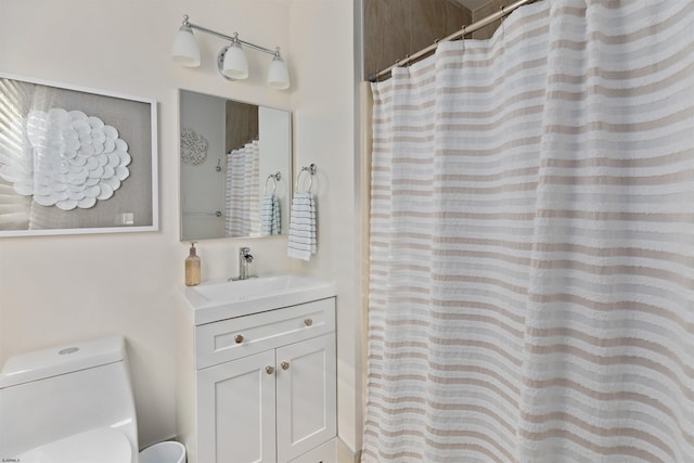 bathroom with vanity, toilet, and a shower with curtain