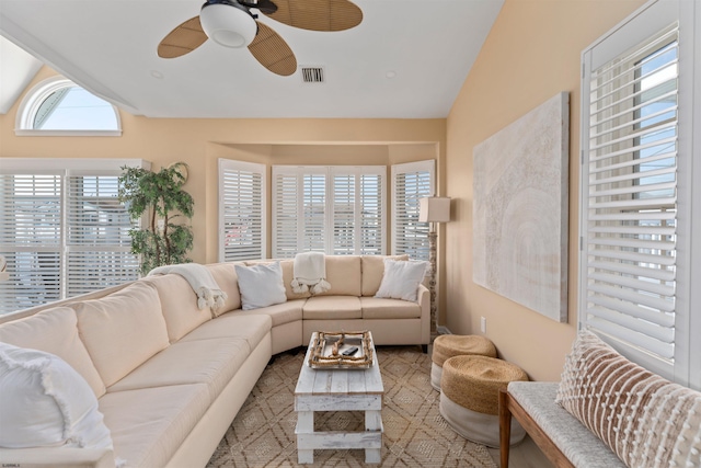 living room featuring vaulted ceiling and ceiling fan