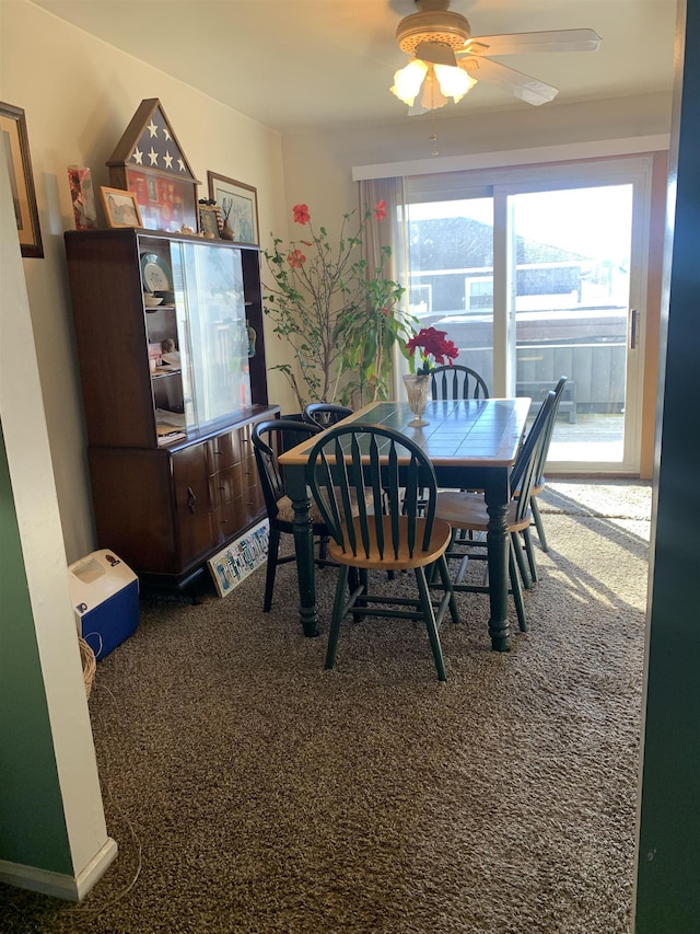 dining room featuring carpet floors and ceiling fan