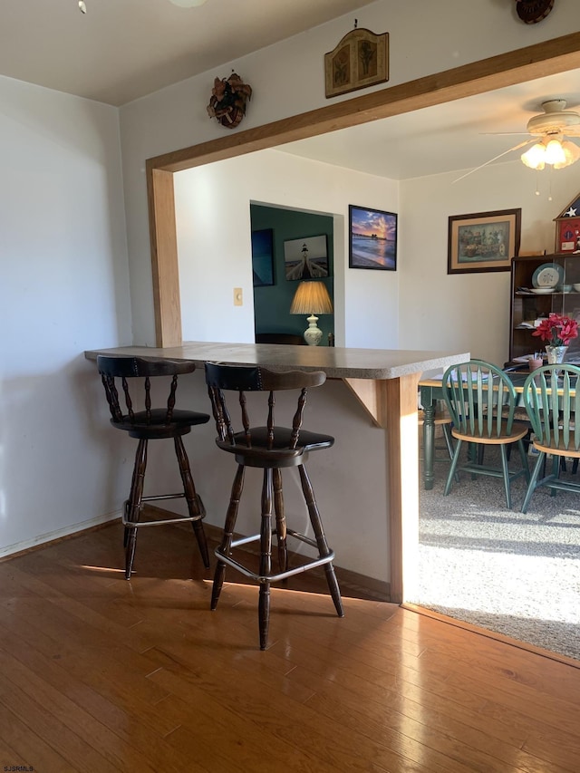 bar featuring hardwood / wood-style floors