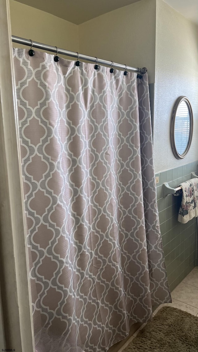 bathroom featuring tile walls and tile patterned flooring