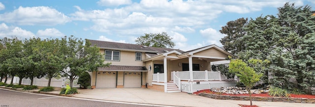 view of front of home featuring a garage and covered porch