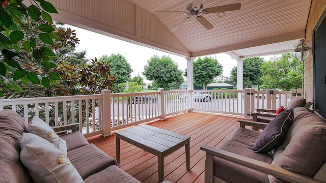 wooden terrace featuring outdoor lounge area and ceiling fan