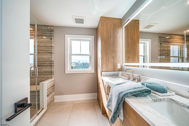 bathroom with vanity, tile patterned floors, and walk in shower