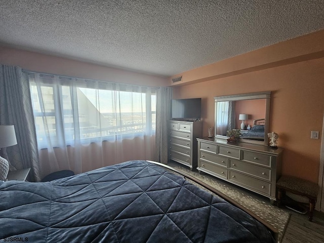 bedroom featuring a textured ceiling