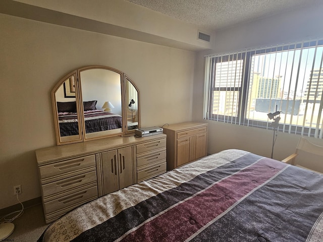 bedroom featuring a textured ceiling