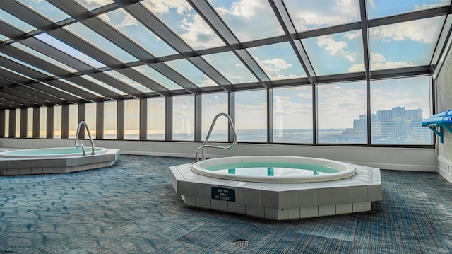 view of swimming pool with an indoor in ground hot tub