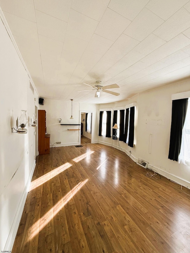 unfurnished room featuring hardwood / wood-style flooring and ceiling fan