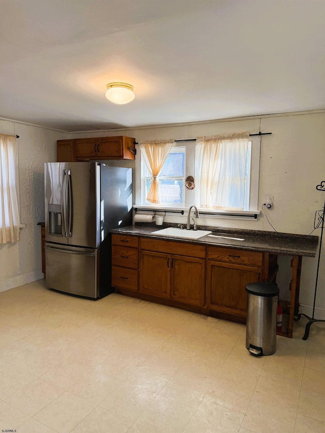 kitchen featuring sink and stainless steel fridge