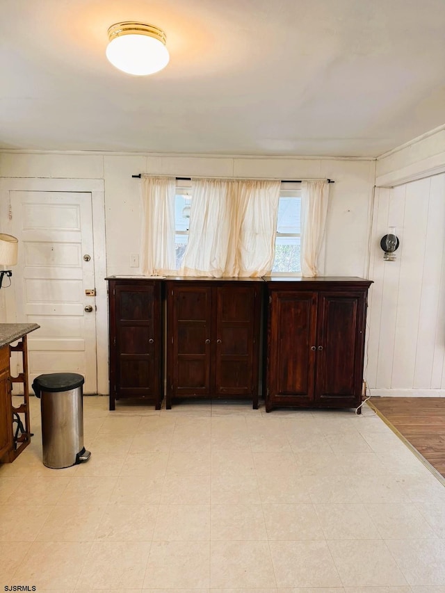 kitchen featuring dark brown cabinets