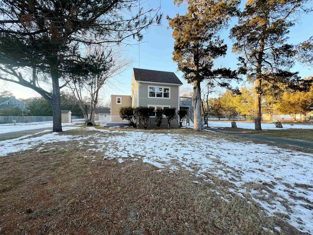 view of front of property with a wooden deck