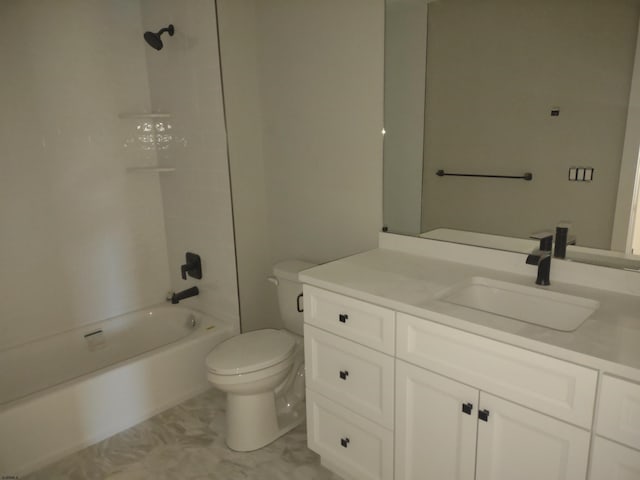 full bathroom with tiled shower / bath, vanity, and toilet