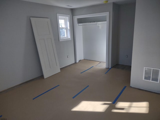 unfurnished bedroom with a closet