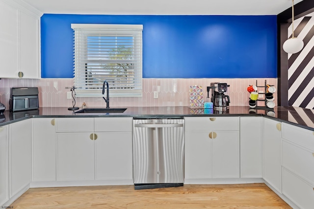 kitchen featuring sink, light hardwood / wood-style flooring, dishwasher, decorative backsplash, and white cabinets