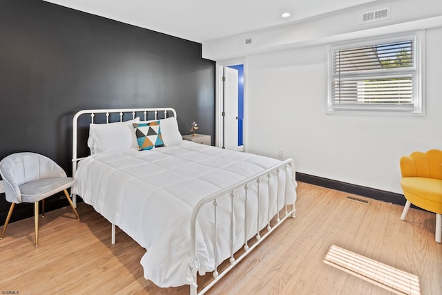 bedroom featuring light wood-type flooring