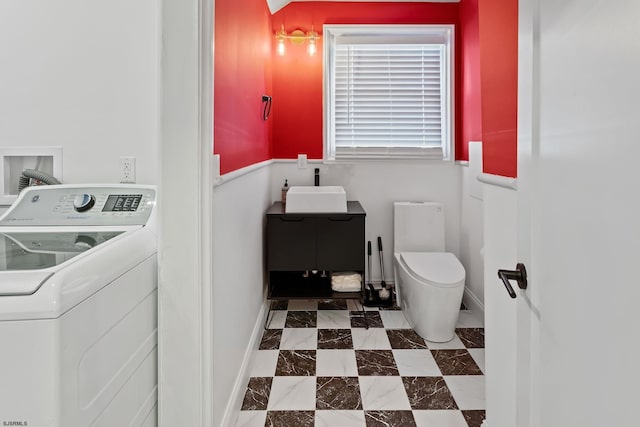 bathroom featuring washer / clothes dryer and sink